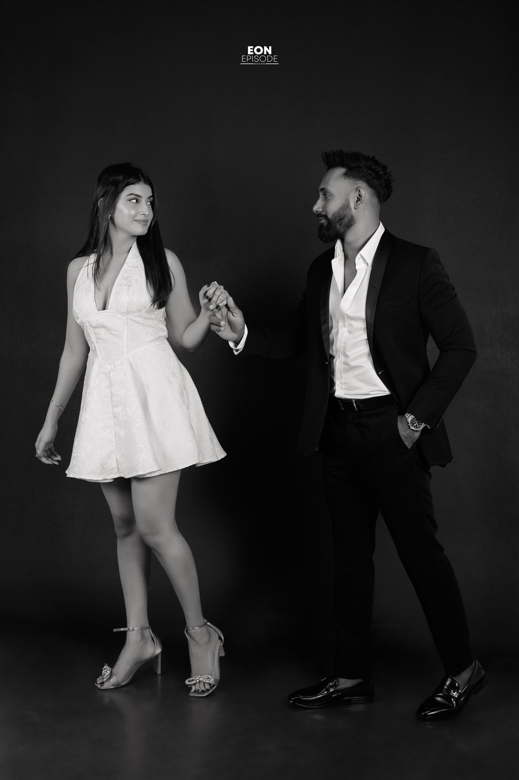 Dananja and Shashie standing together in a black and white preshoot portrait